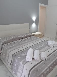 a bedroom with a bed with towels on it at Mare di Roma in Lido di Ostia