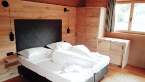 Postel nebo postele na pokoji v ubytování Naturhotel Sonnenhof
