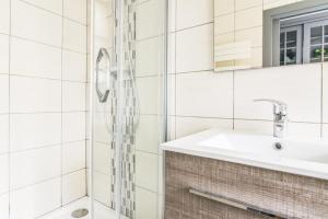 a bathroom with a shower and a sink at Parking - Le Wild Forest - Centre Historique in Phalsbourg