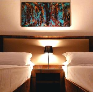Postel nebo postele na pokoji v ubytování Locanda Sapori