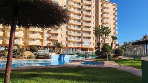 a resort with a swimming pool and a building at La Manga - Puerto y Playa - 3 dormitorios in La Manga del Mar Menor