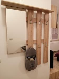 a bag is hanging on a wall at Casa Clau in Arad +2 photos