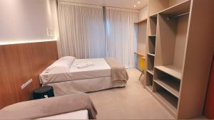 
Cama ou camas em um quarto em Hotel Brasil

