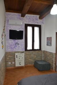 TV a/nebo společenská místnost v ubytování Al centro del porto