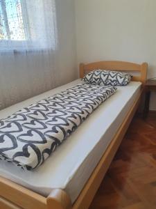 Łóżko lub łóżka w pokoju w obiekcie Diamond M Apartment