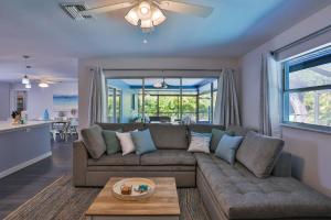 a living room with a couch and a table at Sarasota Serenity in Sarasota