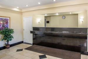 a large bathroom with a large mirror and a sink at Atlantic Inn in Pleasantville +30 photos