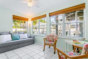 a living room with a couch and a table at Mint Green Getaway in Holmes Beach