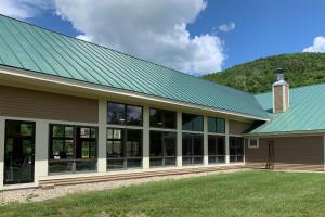 a metal roof on a house with a green roof at First Tracks in Lincoln