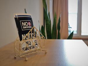a no show sign sitting on top of a table at Eriss Studio Suite - OZone building apartment in Cluj-Napoca