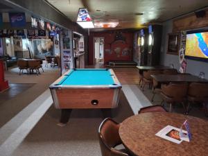 A pool table at The Place Motel & Bar