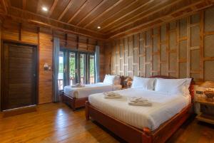 Postel nebo postele na pokoji v ubytování Koh Tao Relax Freedom Beach Resort