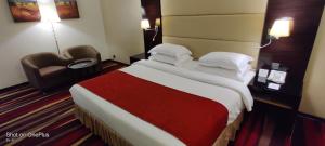 Un ou plusieurs lits dans un hébergement de l'établissement Nehal Hotel