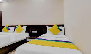 Postelja oz. postelje v sobi nastanitve Hotel Anand Shree Near Airport,Indore