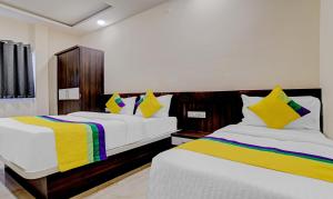 Postelja oz. postelje v sobi nastanitve Hotel Anand Shree Near Airport,Indore