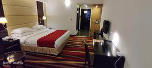 Un ou plusieurs lits dans un hébergement de l'établissement Nehal Hotel