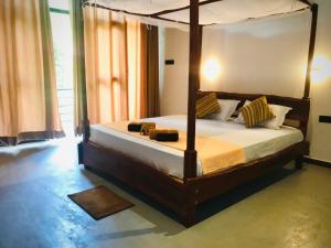 Letto o letti in una camera di Mango Tree House