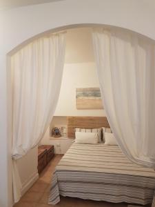 A bed or beds in a room at Appartamentino tipico nel centro