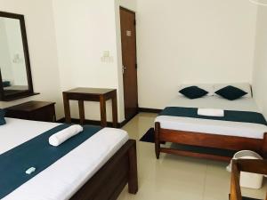 Letto o letti in una camera di Miyonra - Anuradhapura