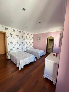 Posteľ alebo postele v izbe v ubytovaní Apartamento Vila O Valadouro 2