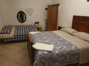 Posteľ alebo postele v izbe v ubytovaní Agriturismo Cognanello