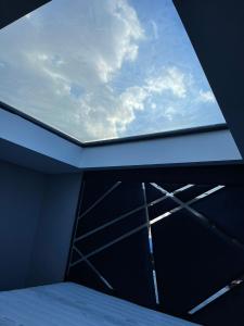 a window in a room with a bed and the sky at KENT Suites hotels Ataşehir in Istanbul