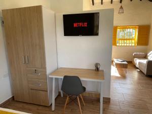 Telewizja i/lub zestaw kina domowego w obiekcie Palmar de Jericó Suites