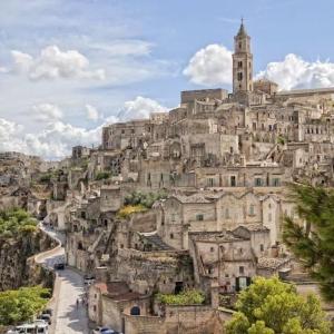 a large mountain with a church on top of it at maison Frima B&B in Matera