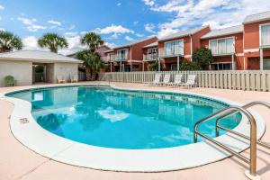 a swimming pool in the courtyard of a apartment complex at Gulf Walk 606 in Destin