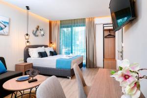 Ένα ή περισσότερα κρεβάτια σε δωμάτιο στο Tereza Golden +36 φωτογραφίες