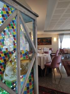 a dining room with a table and chairs at Ristorante Locanda Dussin in Oderzo