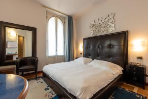 Postel nebo postele na pokoji v ubytování Hotel Moderno