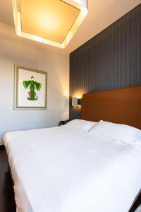 Postel nebo postele na pokoji v ubytování Hotel Moderno