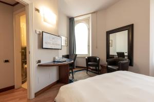 Postel nebo postele na pokoji v ubytování Hotel Moderno
