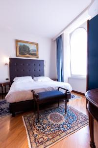 Postel nebo postele na pokoji v ubytování Hotel Moderno
