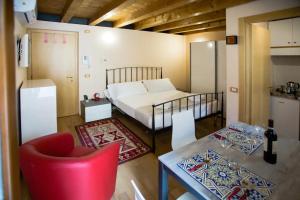 Postel nebo postele na pokoji v ubytování San Zeno Apartments