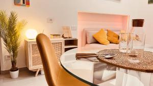 a dining room with a glass table and a couch at The Dream in Massa Lubrense