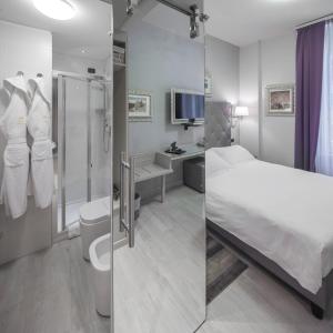 Postel nebo postele na pokoji v ubytování Hotel Moderno