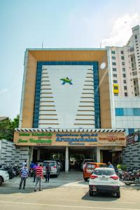 a large building with an airplane on the side of it at Arunaachalaa Resiidency in Chennai