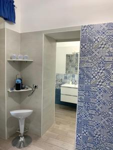 a bathroom with a toilet and a sink at Villa Maria - Family House in Monte di Procida +20 photos