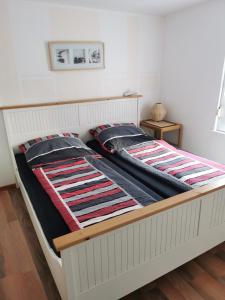 Postel nebo postele na pokoji v ubytování Kleines Ferienhaus mit Charme