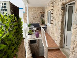 a small balcony with a staircase and plants at Fisherman's Beach Home 2BR 2BA AC Wi-Fi in Albufeira