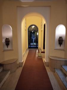 a hallway in a building with an archway at La Calla al Colosseo in Rome