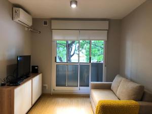 TV a/nebo společenská místnost v ubytování Departamento a estrenar barrio abasto Rosario