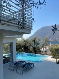 a view of a swimming pool from a house at Verdolivo in Sale Marasino