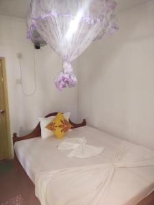 Ένα ή περισσότερα κρεβάτια σε δωμάτιο στο Sigiri Green Shadow Homestay