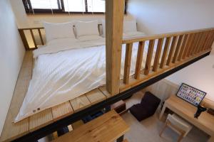 Postel nebo postele na pokoji v ubytování Chuying Sunrise B&B