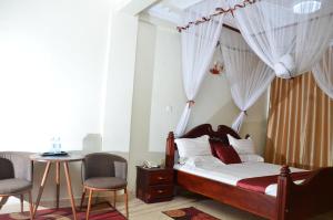 Postel nebo postele na pokoji v ubytování SS Hotel & Apartments Kampala