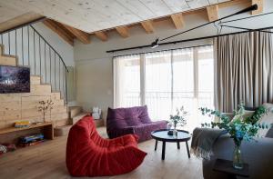 a living room with two chairs and a table at Carina - Design&Lifestyle hotel in Zermatt