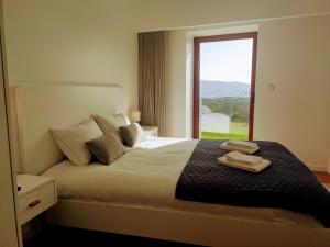 Кровать или кровати в номере Casa de Penedones - Ventos do Larouco